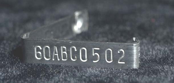 Image of silver USDA identification tag.