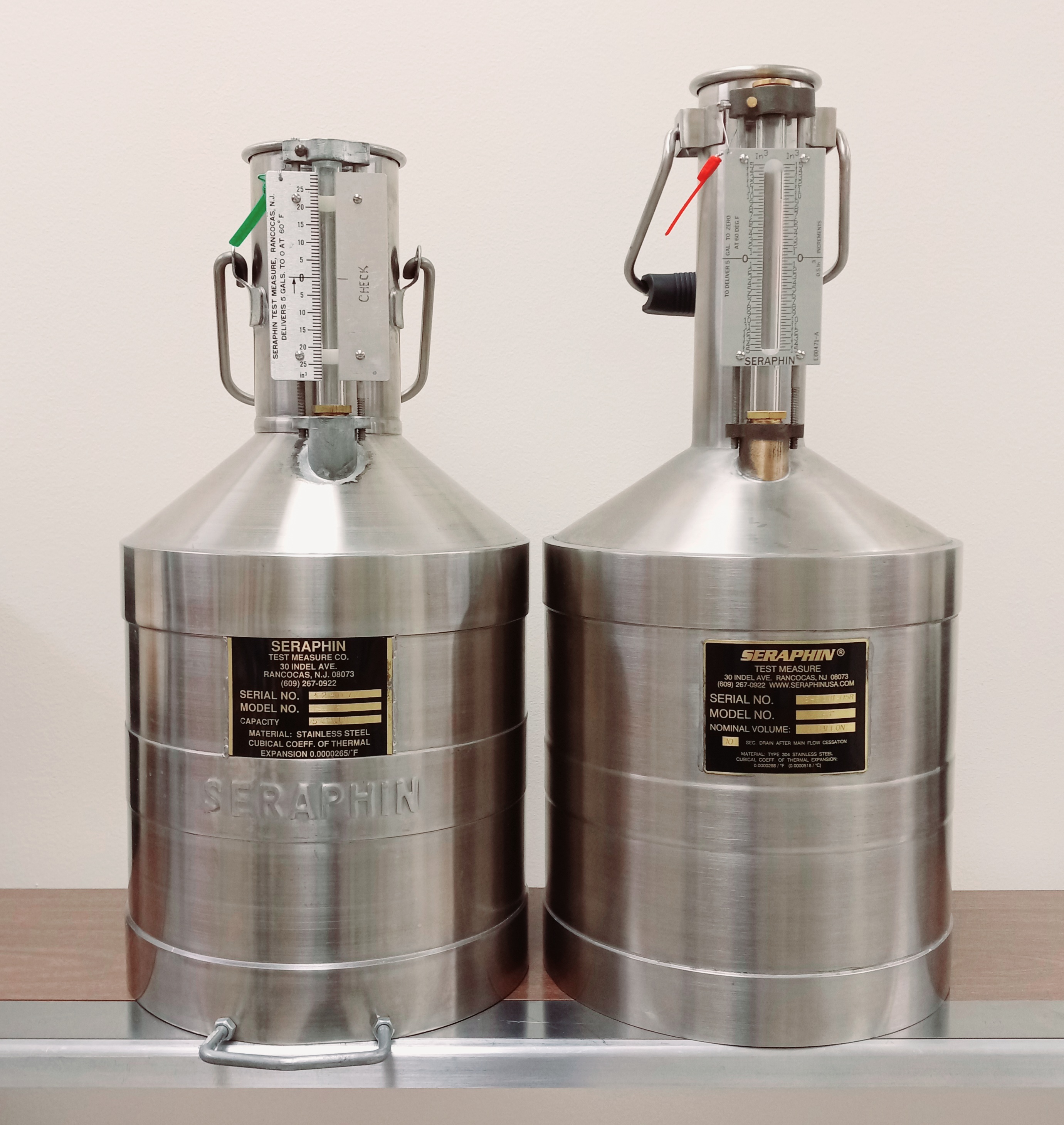 two 5 gallon test standard containers