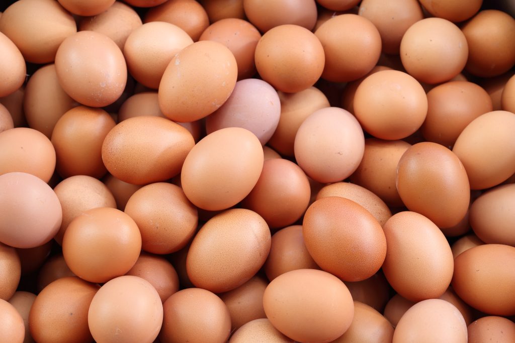 A pile of brown eggs