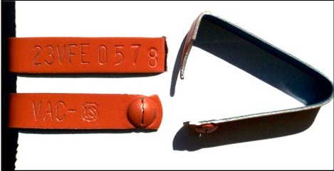 Image showing an orange metal vaccination and identification tag for cattle copyright USDA